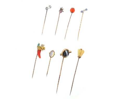 One hundred assorted stick pins, including an early 19th century pin designed as floral arrangement in a cornucopia-style car