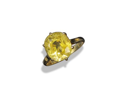 A yellow sapphire solitaire ring, the oval-shaped yellow sapphire weighs approximately 7.50cts and is claw set in yellow gold