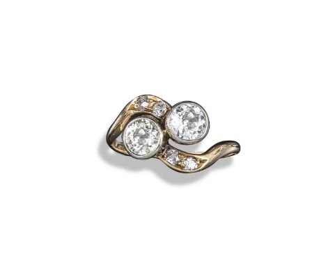 A diamond crossover ring, the two round brilliant-cut diamonds are rubover-set, with four further circular-cut diamonds to th