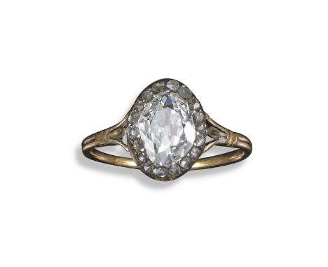 A George III diamond solitaire ring, set with an oval/marquise-shaped diamond within a border of rose-cut diamonds in silver 