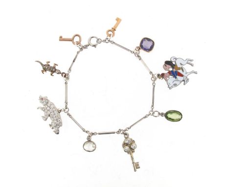 An unusual charm bracelet, the bar-link platinum bracelet mounted with a Van Cleef & Arpels cartoon charm with enamel decorat