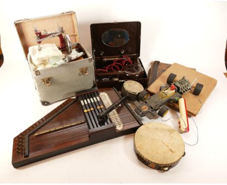 A twentieth century wooden Autoharp, twenty-four strings, two of which are missing, together with a tambourine, an Essex mini
