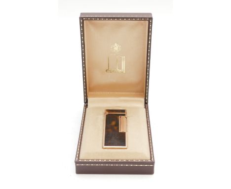 Alfred Dunhill Paris; A modern Dunhill pocket cigarette lighter, gold plated with lacquered tortoise shell pattern casing, bo