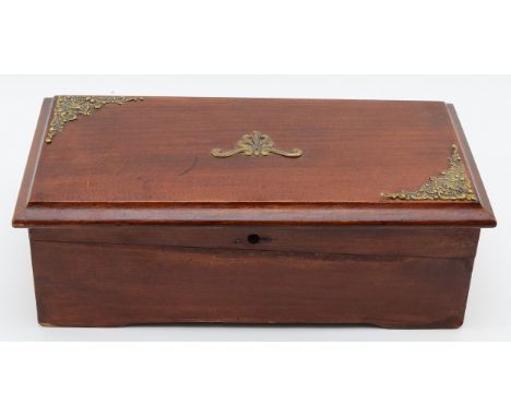 An early twentieth century mahogany cased music box, the hinged cover opening to a brass key wound cylinder movement with ste