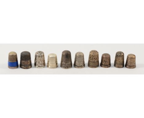A silver and blue enamel, Birmingham 1924, together with eight other silver thimbles and one sterling silver thimble, 40gm (1