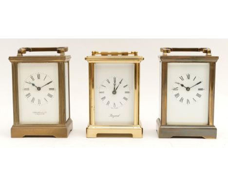 Three mid to late twentieth century brass carriage clocks, housing eight day movements, to include, a Garrard &amp; Co exampl