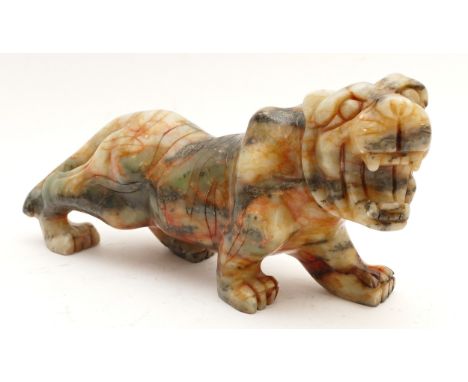 A mottled green and red carved Jade tiger, L-27cm.