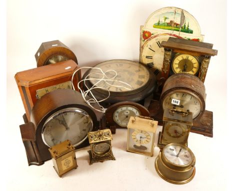 A collection of mid 20th century and later mantel and wall clocks, to include an English 8 day carriage clock, having silvere