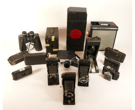 A collection of cameras and camera accessories, to include, a quantity of darkroom equipment, a Polavision Land Camera, a Day