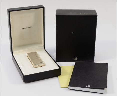Alfred Dunhill London; A silver plated Dunhill 'Rollagas' pocket cigarette lighter, cased with purchase papers and instructio