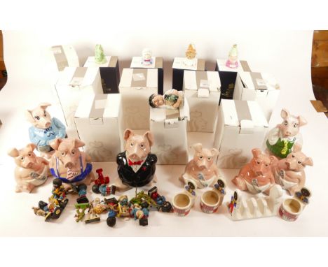 Eight Wade Natwest piggy banks, featuring five different models, together with a quantity of Royal Doulton and Royal Worceste