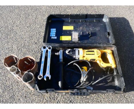 A boxed DeWalt D21580-LX 110v 1310w diamond drill with attachments.