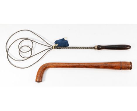 A Victorian hardwood tipstaff, with a curved handle and a pokerwork embellishment, in the form of three lines encircling the 