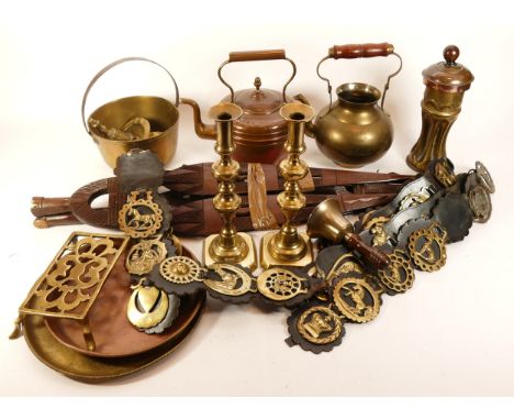 An assortment of metalwares, primarily brass and copper, to include, a Samovar, a stove-top teapot, and various candlestick h