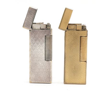 Alfred Dunhill London; Comprising silver plated Rollagas cigarette lighter, having engine turned casing, together with a gold