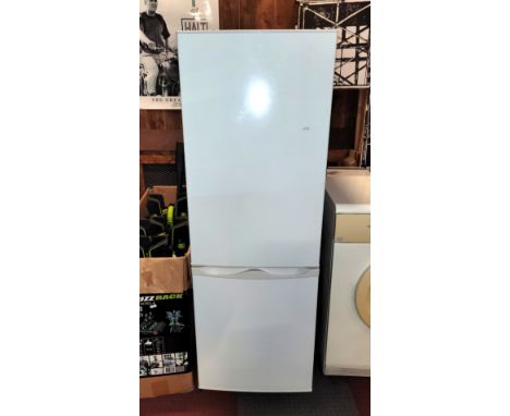 A free standing Essentials fridge freezer, H143, W49, D55cm, with manual, appears to be unused.
