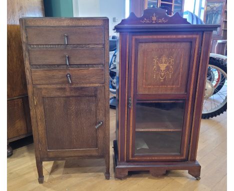 An Edwardian inlaid mahogany music cabinet, the rectangular top with shaped cornice over single semi glazed door, crossbanded