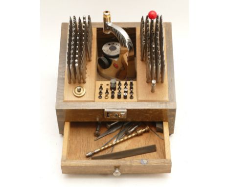 A Japanese Meikosha staking tool kit, in wooden case with curved cover, nearly complete and in good order.