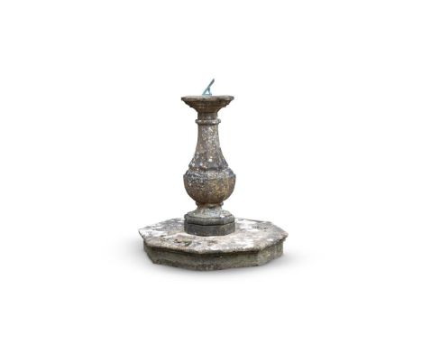 AN OCTAGONAL HAMSTONE SUNDIAL PEDESTAL  18TH CENTURY  With a bronze 26cm wide octagonal sundial plate signed W Holland Cheste