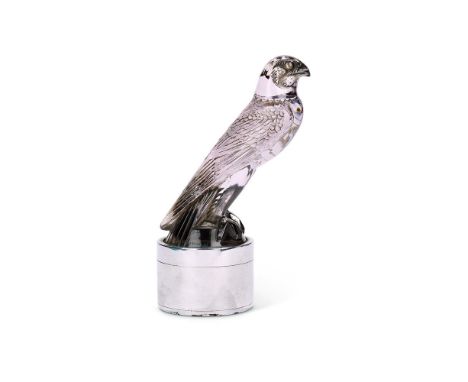 AN ART DECO MAUVE TINTED GLASS FALCON CAR MASCOT BY RENÉ LALIQUE  CIRCA 1925  Model number 1124, base stamped 'BREVES GALLERI