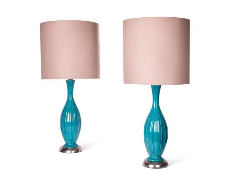 A PAIR OF TURQUOISE RIBBED CERAMIC LAMPS  MID 20TH CENTURY  Set of nickel plated bases  Bases 94cm high  