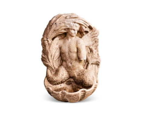 A CARVED MARBLE WALL FOUNTAIN WITH TRITON DECORATION  PROBABLY ITALIAN, 18TH CENTURY  The triton or merman of twin tail form,