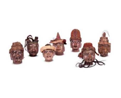 A SET OF SEVEN WOODEN PUPPET HEADS  NORTH INDIAN, 19TH CENTURY  Differing theatrical characters, painted surfaces, glass eyes