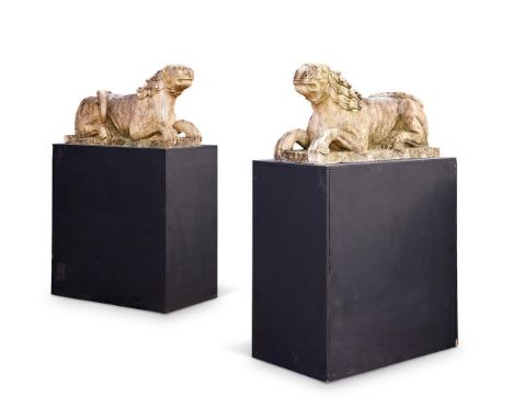 A PAIR OF ITALIAN WHITE MARBLE LIONS  18TH CENTURY IN THE RENAISSANCE STYLE  Reclining lions formerly supporting columns  54c