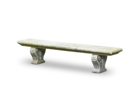 A MARBLE GARDEN OR ARRAS BENCH  20TH CENTURY  Rectangular top on twin supports with female mask within shells decoration  48c