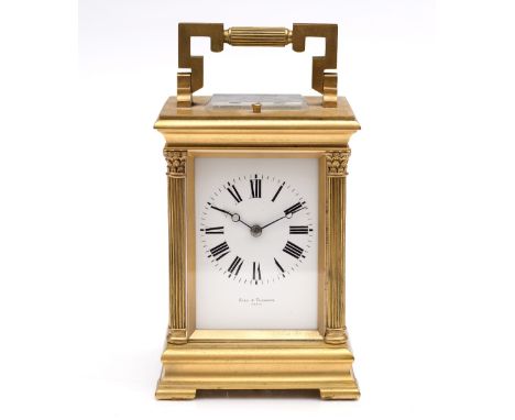 A 19th Century brass carriage clock with repeat mechanism by Aird & Thomson of Paris, with loop handle and enamel dial