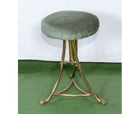 A brass tripod base rise and fall piano stool
