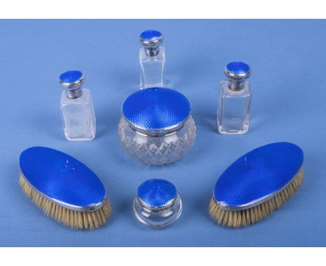Blue engine turned silver dressing table set, three small bottles, 8.5cm tall marks for Birmingham WCG 1926.. Two brushes and