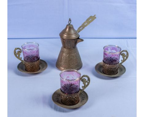 A Turkish/Middle Eastern vintage coffee pot with three glass cups and saucers