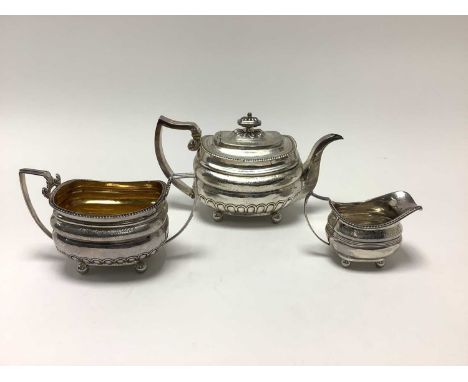 George III composite three piece silver teaset, comprising teapot of bellied form, with engraved floral decoration and gadroo