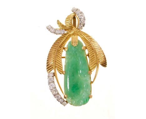 Carved jade and diamond pendant/brooch, the Chinese caved green jade panel depicitng fruit in a gold mount with textured yell