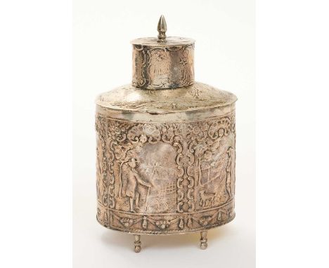 19th century Dutch silver tea caddy of oval form, with embossed rural scene decoration and slip on cover, on four peg feet (u