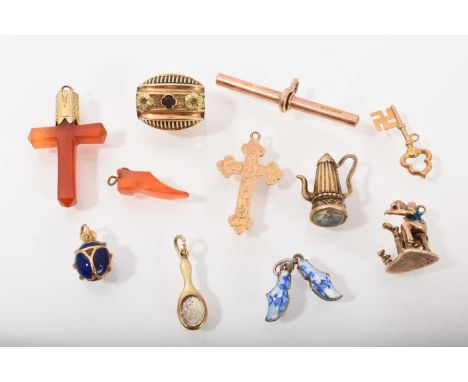 Group of antique charms to include an early Victorian gold and enamel slide/toggle, gold and enamel ladybird pendant and vari