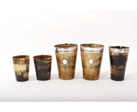 Five antique horn beakers including three silver-mounted, marks very worn, the tallest 11cm