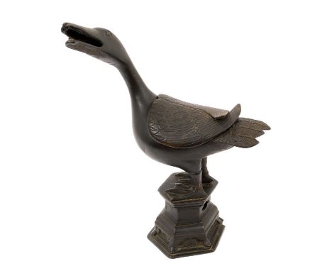 Chinese bronze censer in the form of a duck, Ming Dynasty, shown standing with head outstretched, on a pierced canted platfor