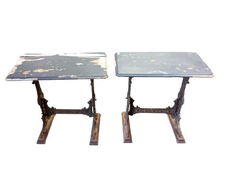 Pair of Victorian cast iron table bases, the decorative end standards with scroll and pierced decoration joined by a stretche