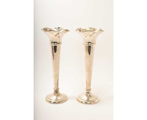 Pair of very large silver trumpet vases, with slender tapering stems and flared tops, on circular pedestal bases, loaded (She