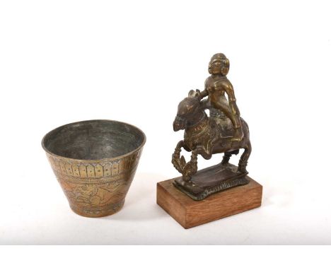 Indian brass figure of a horse and rider, 18th/19th century, 13cm high, raised on wooden plinth, and an Indian brass bowl of 