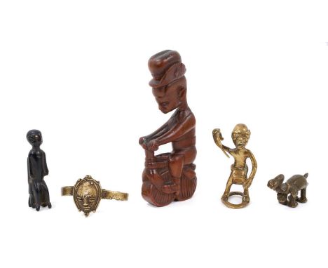 Group of African items, including a carved wooden figure on a bicycle, possibly Kamba, two Ashanti brass gold weights, brass 