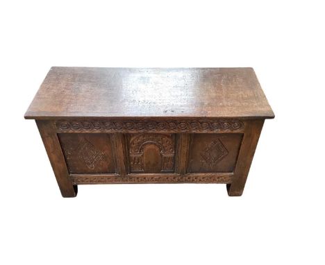 17th century oak coffer, with triple carved panel front raised on stiles, 98cm wide x 38cm deep x 53cm high