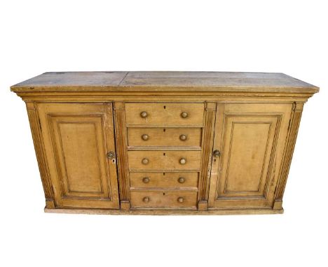 Unusual 19th century grained pine sideboard, with hinged section to the left enclosing appertures for wash basin, centred by 