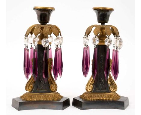 Pair of Regency ormolu and bronze mounted candlesticks, hung with purple prismatic drops, on spread shaped triangular base, 2