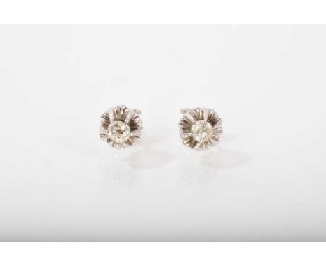 Pair of diamond single stone stud earrings each with an old cut diamond in a rosette shaped claw setting with post and butter