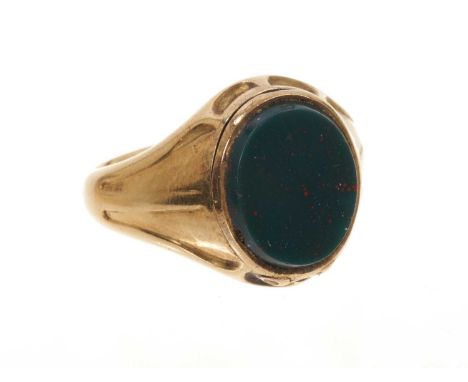 Late Victorian gold and bloodstone poison ring, the hinged oval bloodstone bezel opening to reveal a secret compartment conta