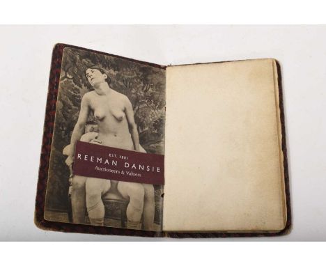 A rare 1920s pocket-sized book of explicit pornography, 24 images in total, board ends, total size 12 x 8cm