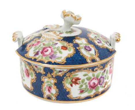 Worcester butter tub and cover, c.1770, polychrome decorated with flowers within gilt scrollwork cartouches, on a blue scale 